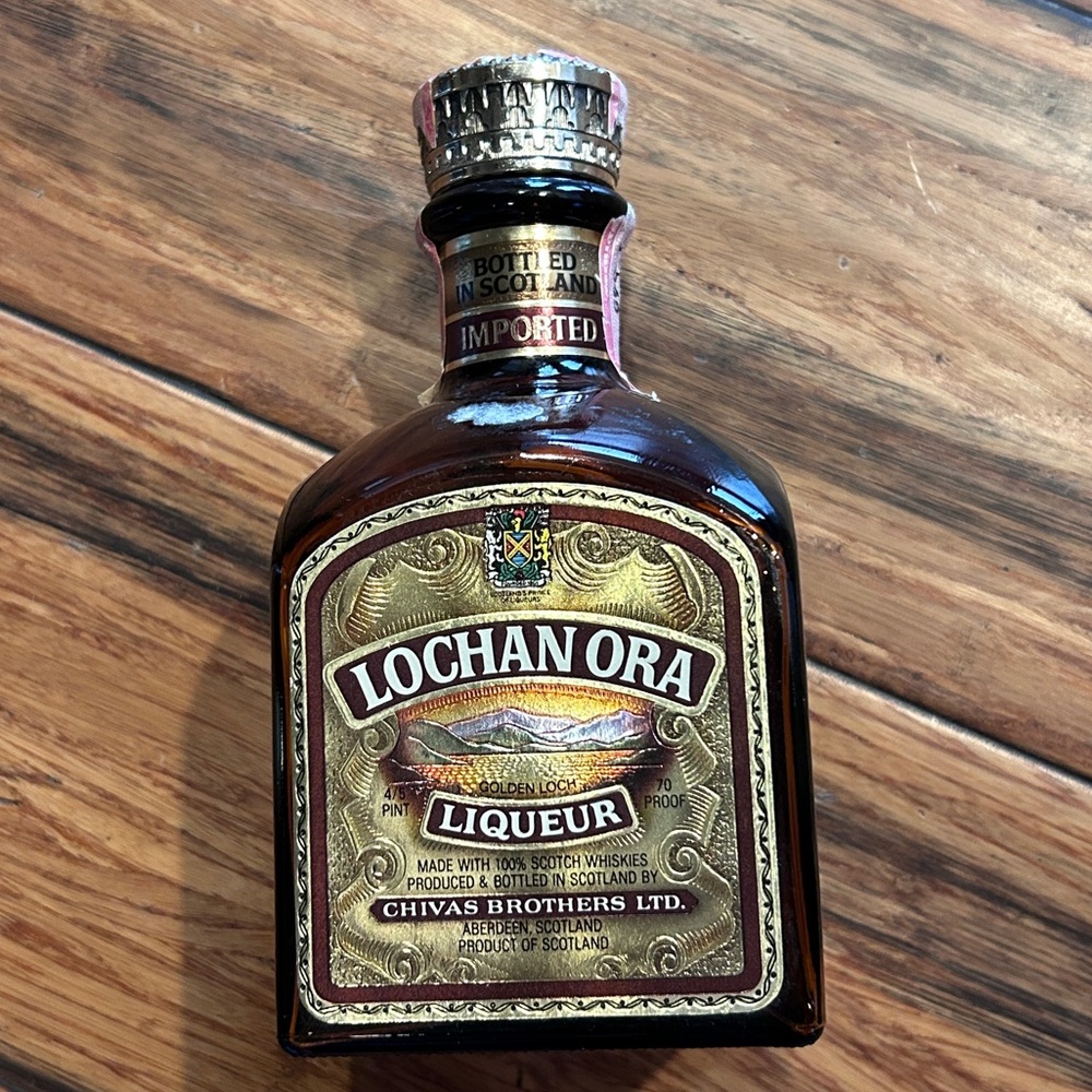 Vintage 1970s Lochan Ora Golden Loch Liqueur empty bottle. Chivas Brothers Ltd.